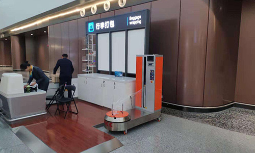 Luggage packers are becoming "standard equipment" at airports and passenger stations